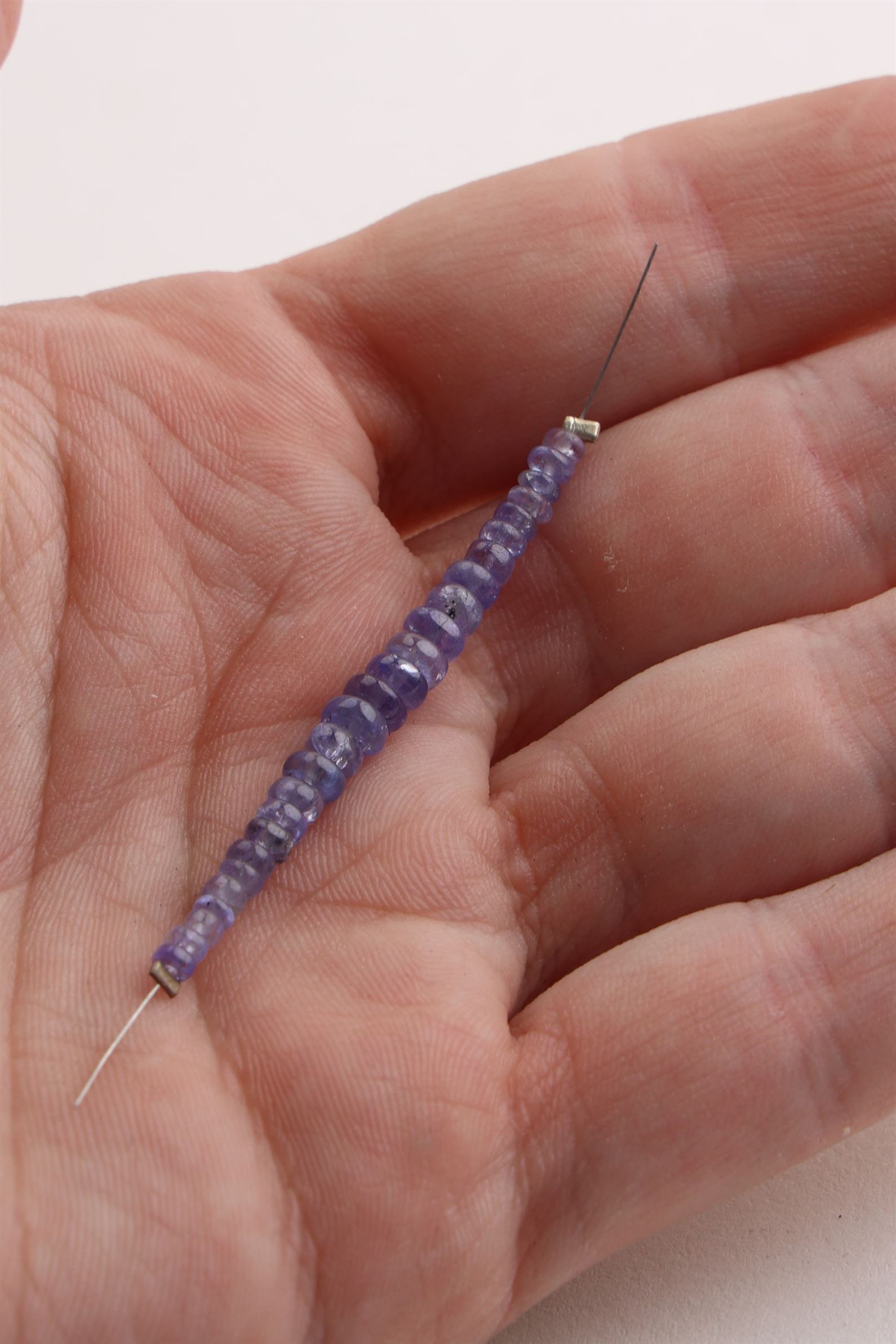 Small Donut Round Tanzanite Bead Strand (24 Beads)